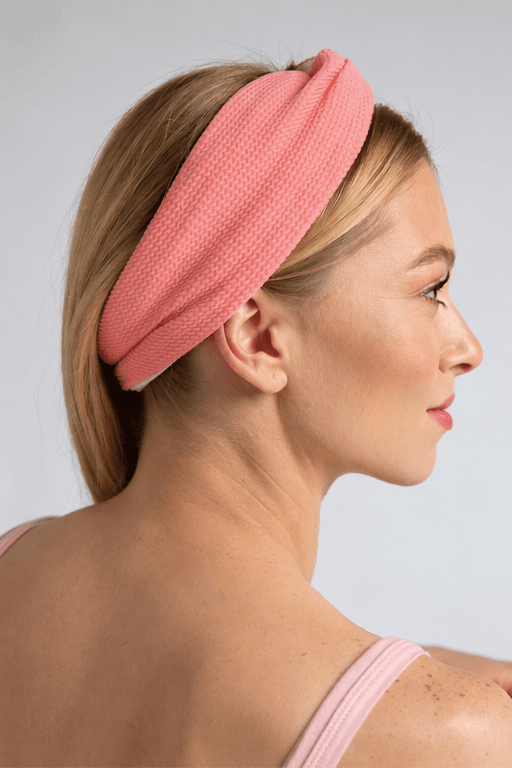 Lullipop reversible twist headband in pink, worn