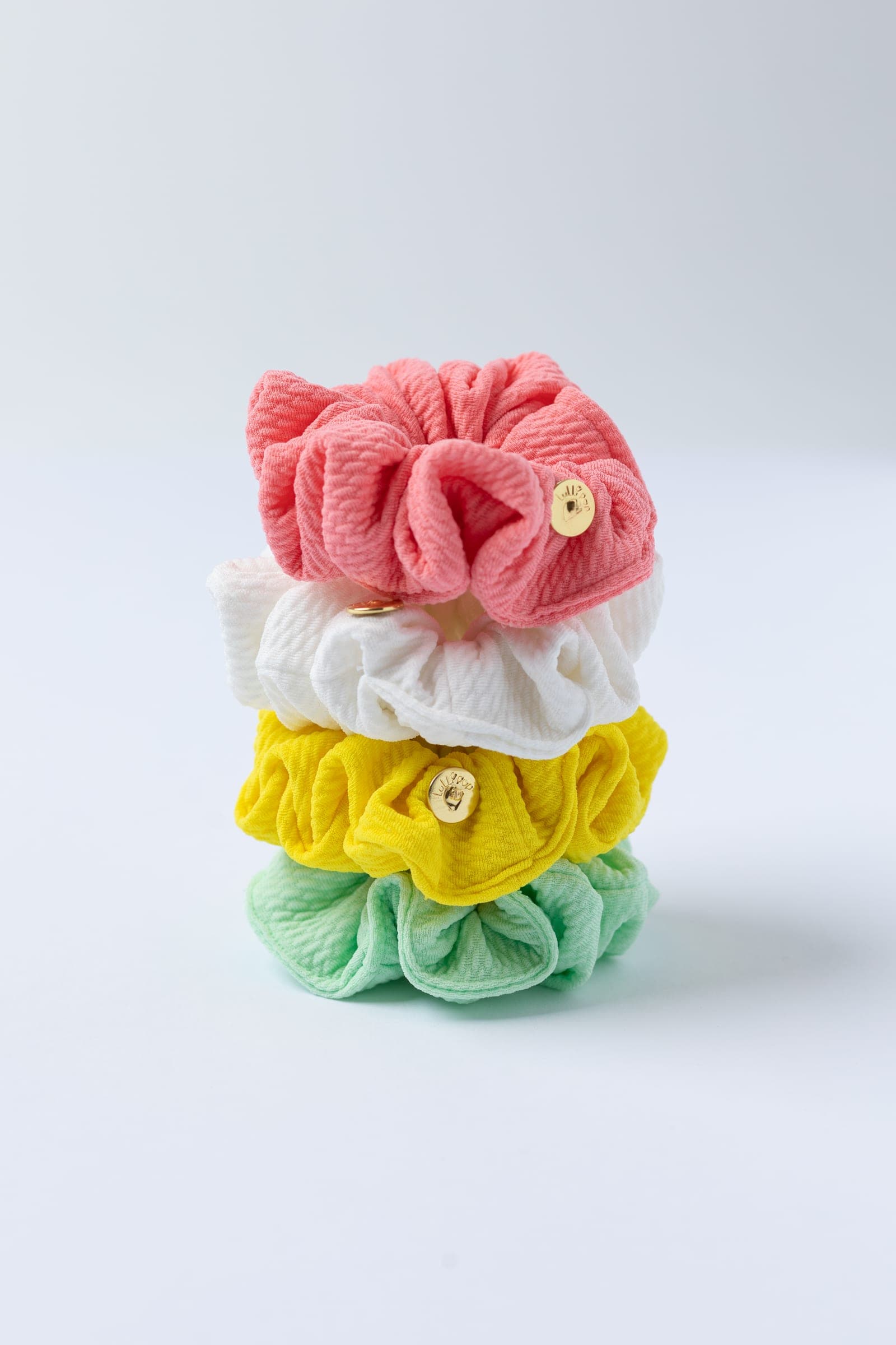 Lullipop scrunchies stacked; collection photograph, colors may differ